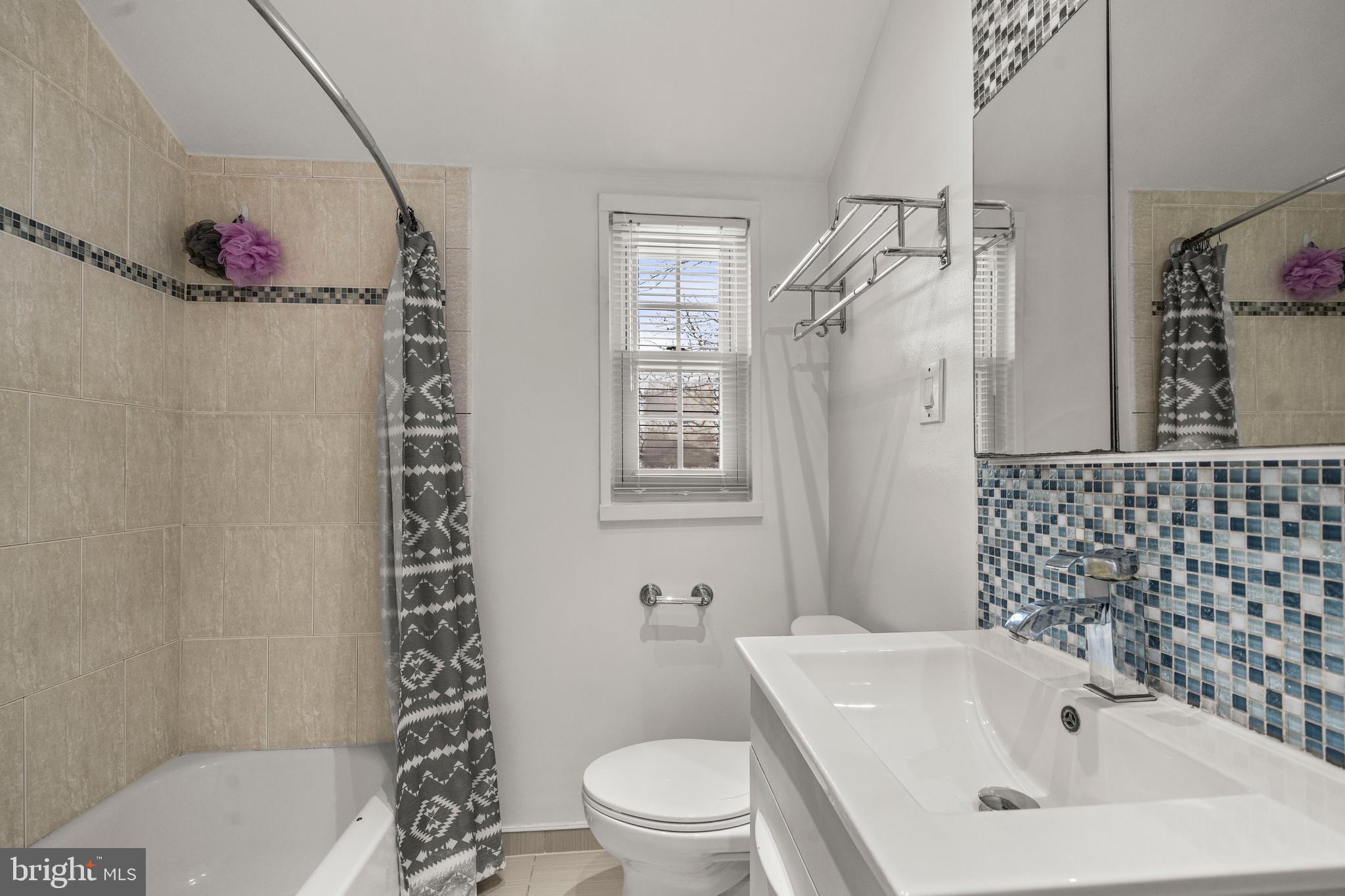 4244 Hildreth Street Southeast Washington, DC 20019 - Photo 17 of 31 a bathroom with a sink toilet and shower