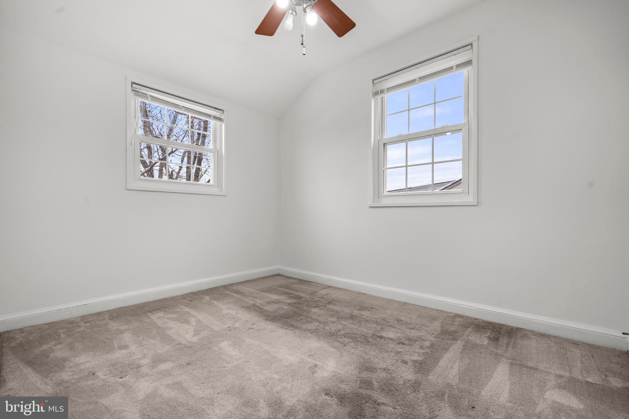 4244 Hildreth Street Southeast Washington, DC 20019 - Photo 20 of 31 an empty room with chandelier fan and window