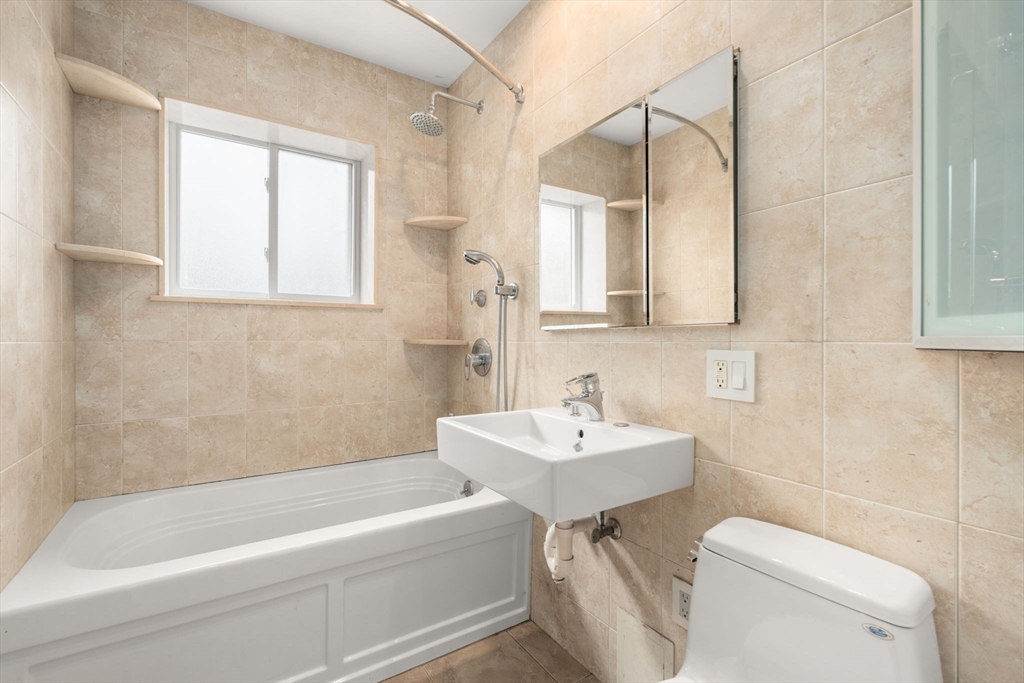 21 Westgate Road, Unit 6 Chestnut Hill, MA 02467 - Photo 16 of 28 a bathroom with a sink a toilet and bathtub