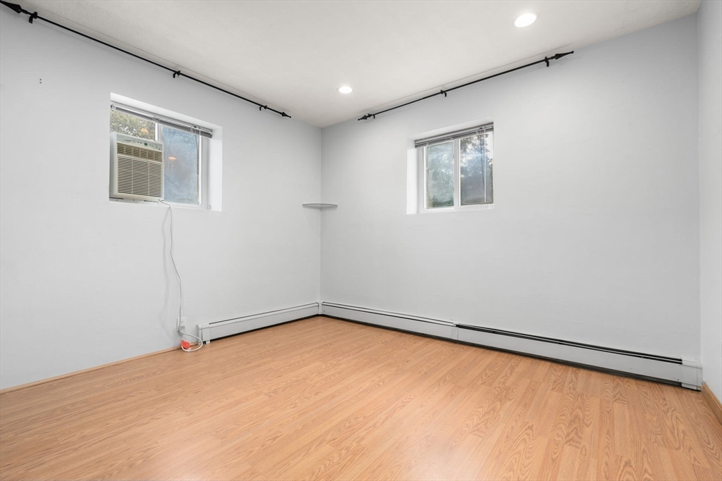 21 Westgate Road, Unit 6 Chestnut Hill, MA 02467 - Photo 18 of 28 an empty room with a window