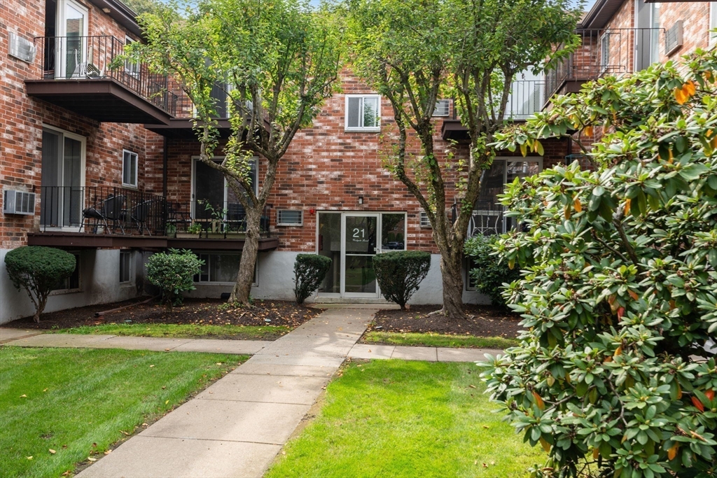 21 Westgate Road, Unit 6 Chestnut Hill, MA 02467 - Photo 22 of 28 a view of house with yard outdoor seating and entertaining space
