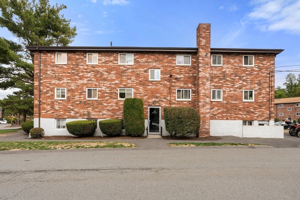 21 Westgate Road, Unit 6 Chestnut Hill, MA 02467 - Photo 28 of 28 a front view of a building with garden