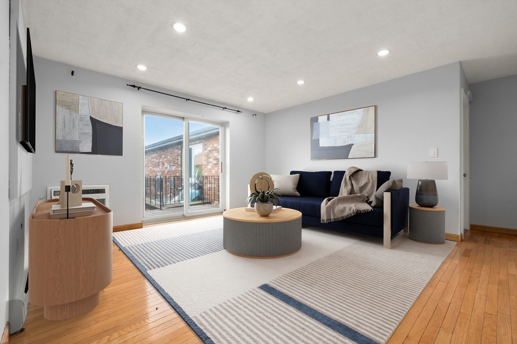 21 Westgate Road, Unit 6 Chestnut Hill, MA 02467 - Photo 5 of 28 a living room with furniture and a wooden floor