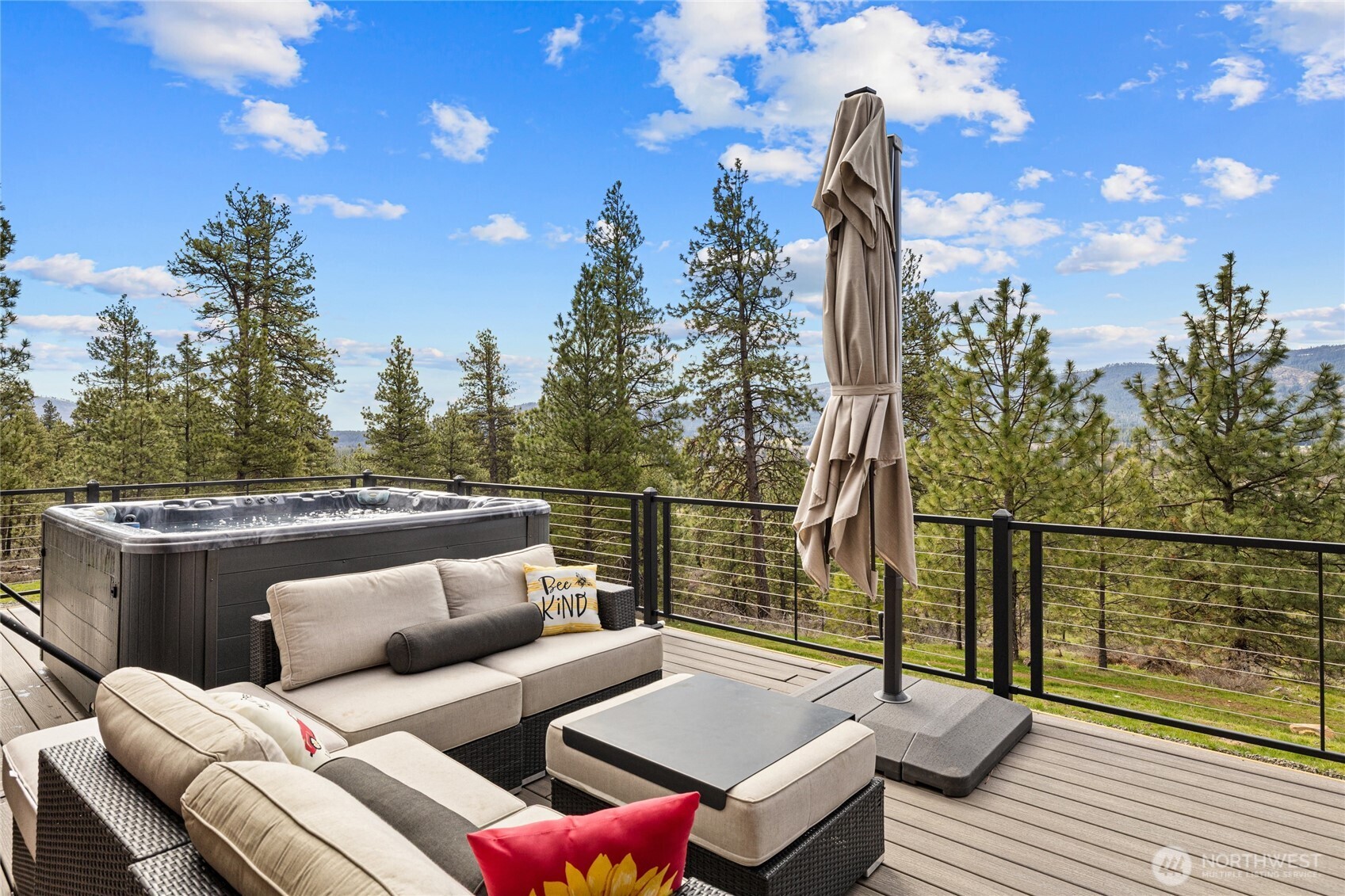 340 Powerline Road Cle Elum, WA 98922 - Photo 20 of 40 a balcony with wooden floor and outdoor seating