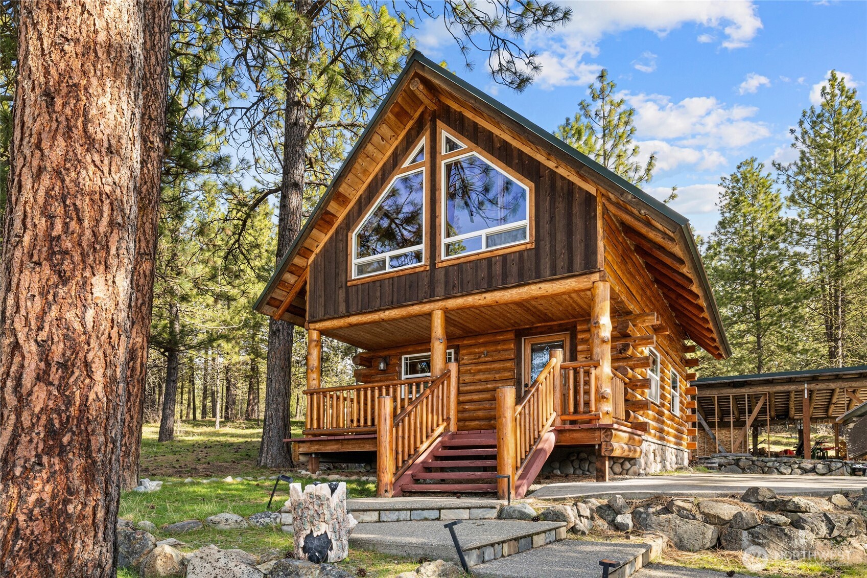 340 Powerline Road Cle Elum, WA 98922 - Photo 22 of 40 a front view of a house with a yard