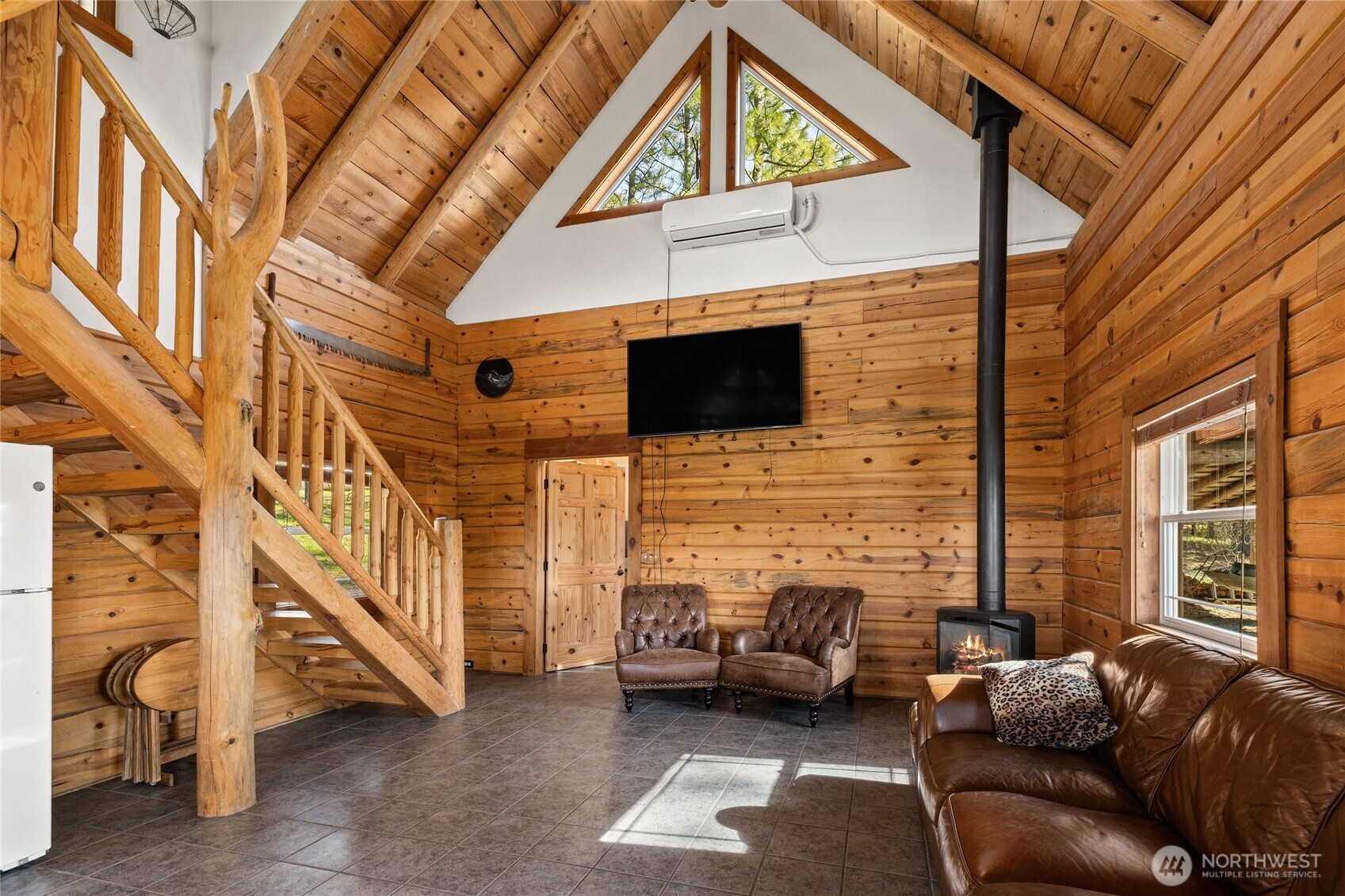 340 Powerline Road Cle Elum, WA 98922 - Photo 23 of 40 a living room with furniture a fireplace and a ceiling fan