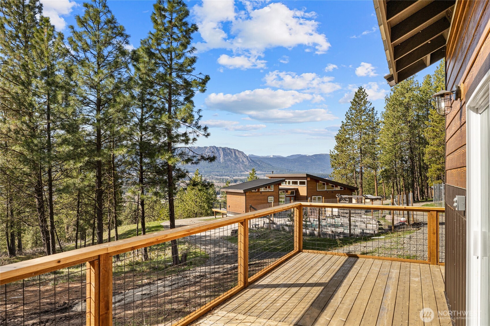 340 Powerline Road Cle Elum, WA 98922 - Photo 29 of 40 a view of a balcony with wooden floor and fence