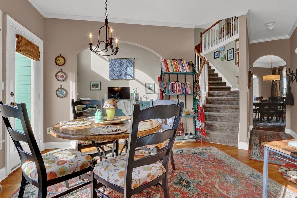 2095 Pinehurst View Drive Grayson, GA 30017 - Photo 15 of 45 a view of a dining room with furniture and a chandelier