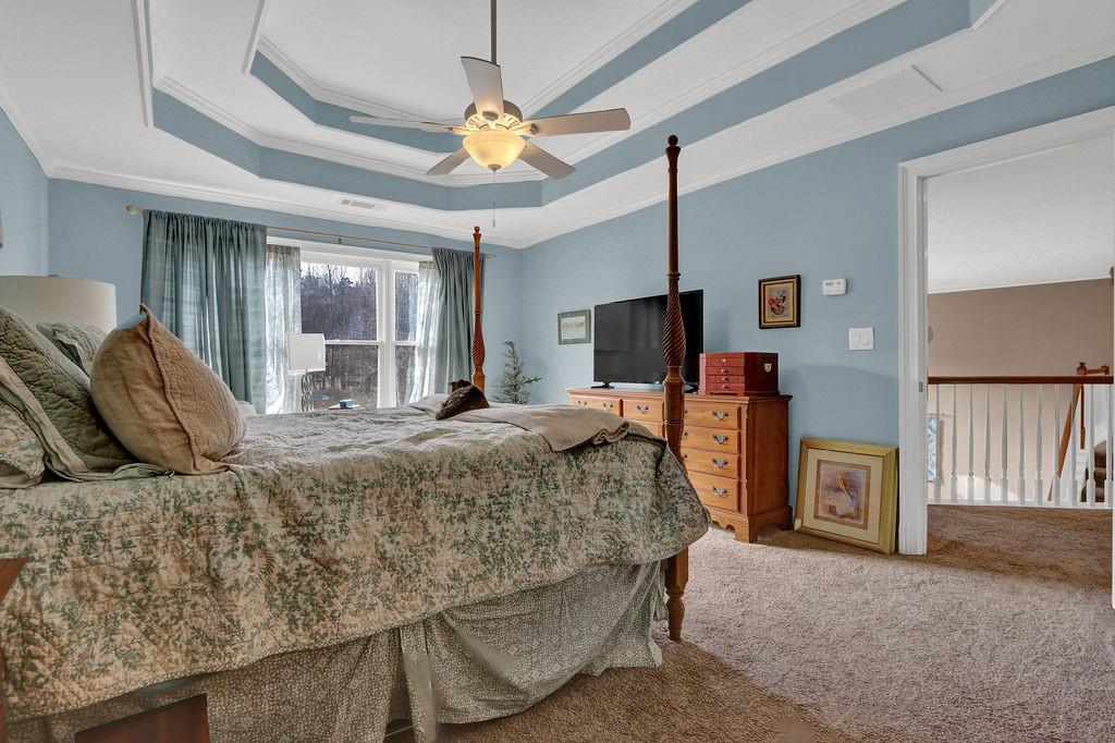 2095 Pinehurst View Drive Grayson, GA 30017 - Photo 26 of 45 a bedroom with a bed and a chandelier