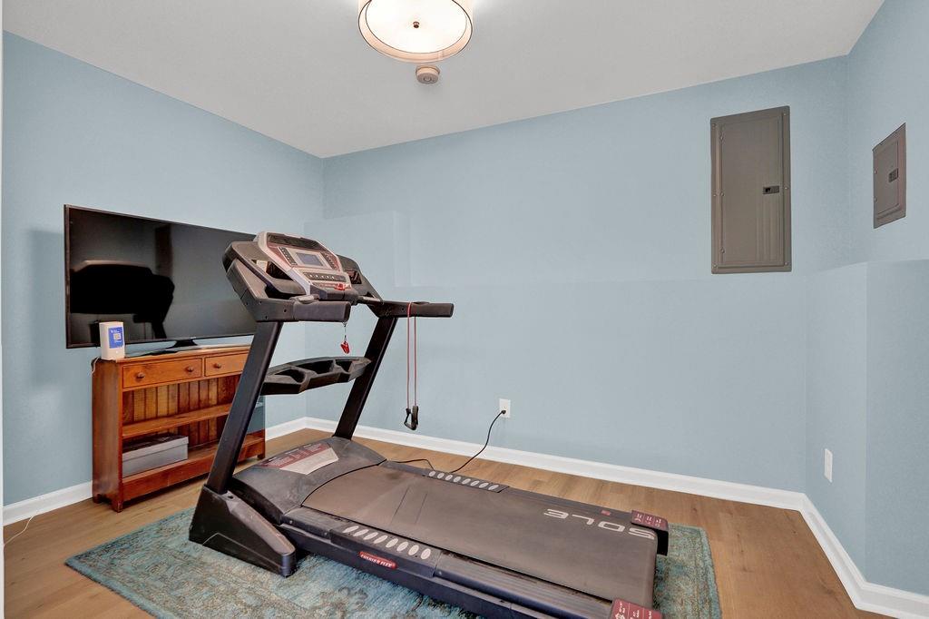 2095 Pinehurst View Drive Grayson, GA 30017 - Photo 32 of 45 a room with furniture and wooden floor