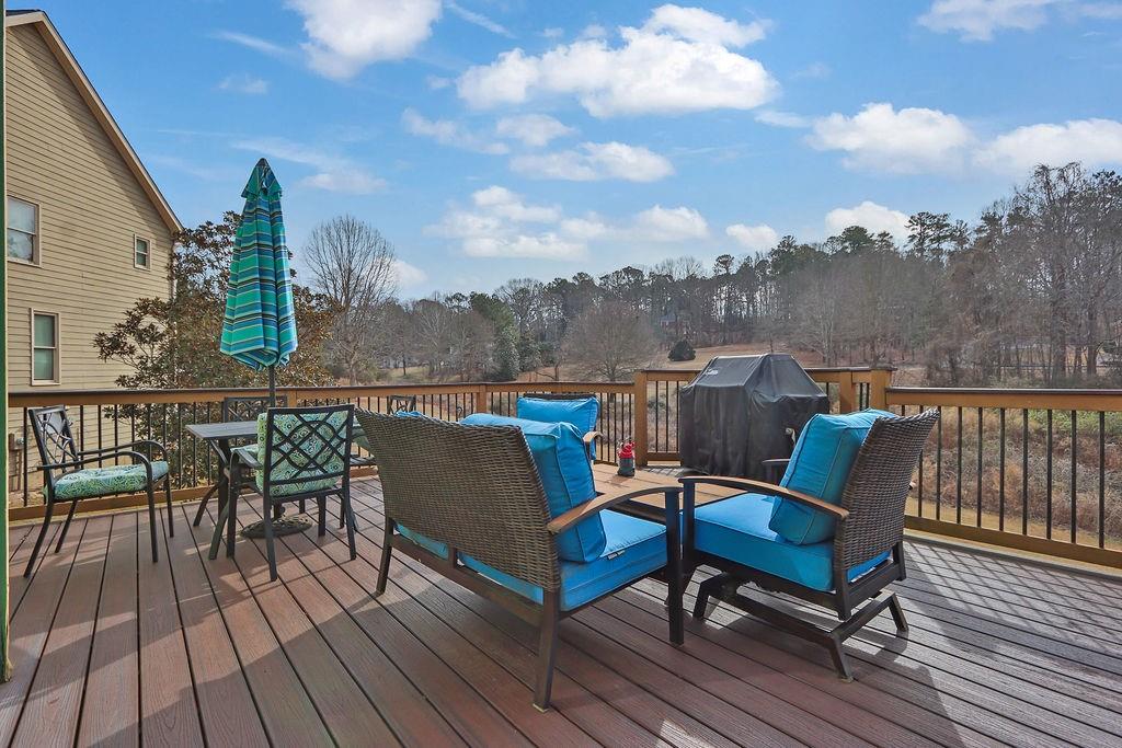 2095 Pinehurst View Drive Grayson, GA 30017 - Photo 39 of 45 an outdoor sitting area with furniture and wooden floor