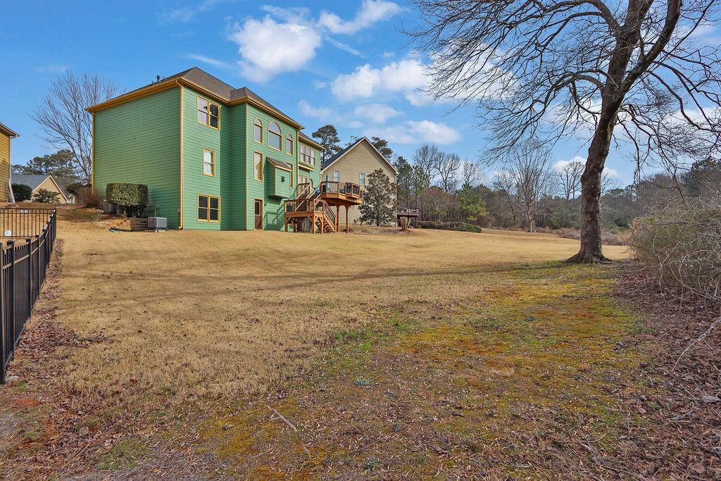2095 Pinehurst View Drive Grayson, GA 30017 - Photo 44 of 45 a view of a house with backyard and trees