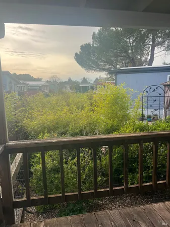 a balcony with view of an outdoor space