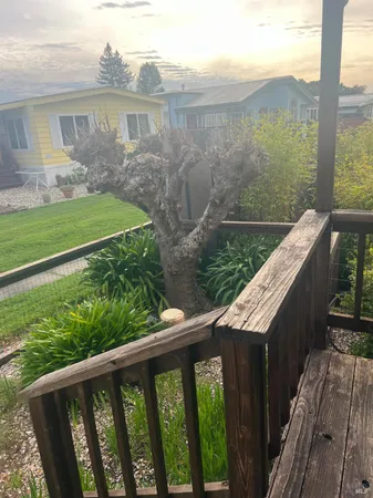a view of a brick wall with a bench in front of it