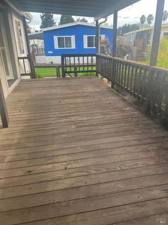 a view of balcony with wooden floor