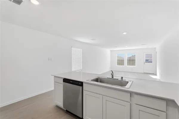 a kitchen with a sink and a window