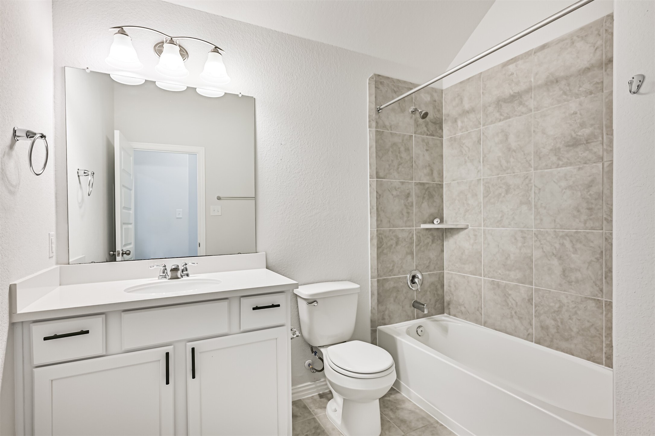 7019 Terra Drive Manvel, TX 77578 - Photo 13 of 41 a bathroom with a sink a toilet and shower