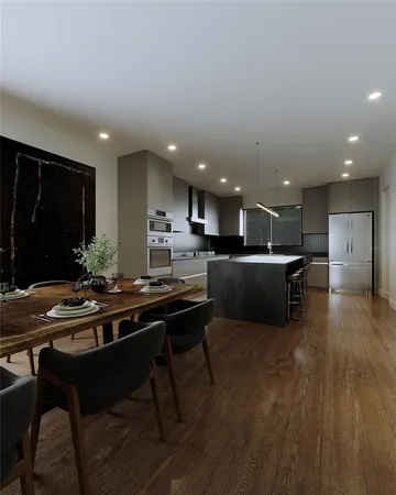 a kitchen with a table and chairs in it