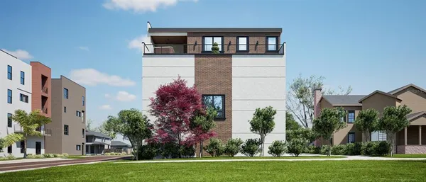 a front view of a house with a yard and trees