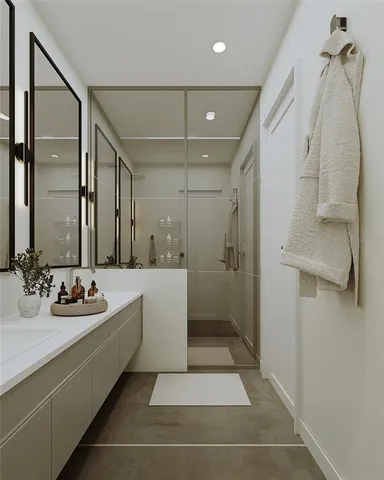a bathroom with a bathtub and a mirror