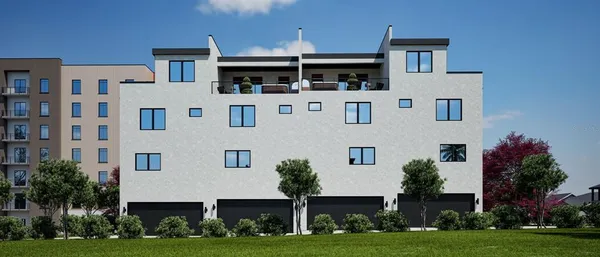 a view of a brick building next to a yard