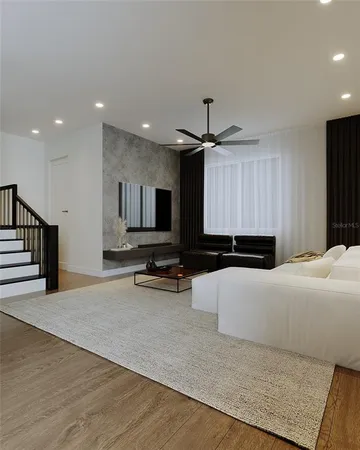 a living room with furniture a flat screen tv and a lamp