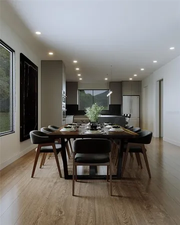 a kitchen with a table and chairs in it