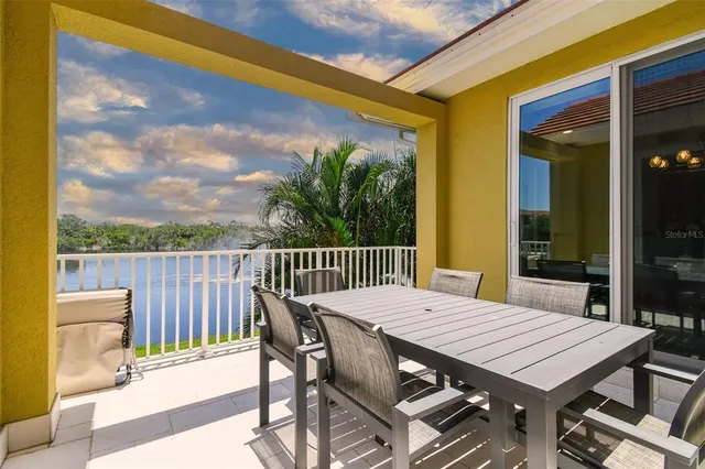 a view of a patio with a table and chairs