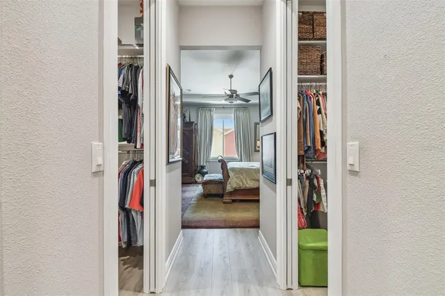 a view of a walk in closet with living room