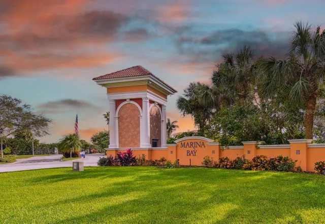 a group of people sitting in a yard