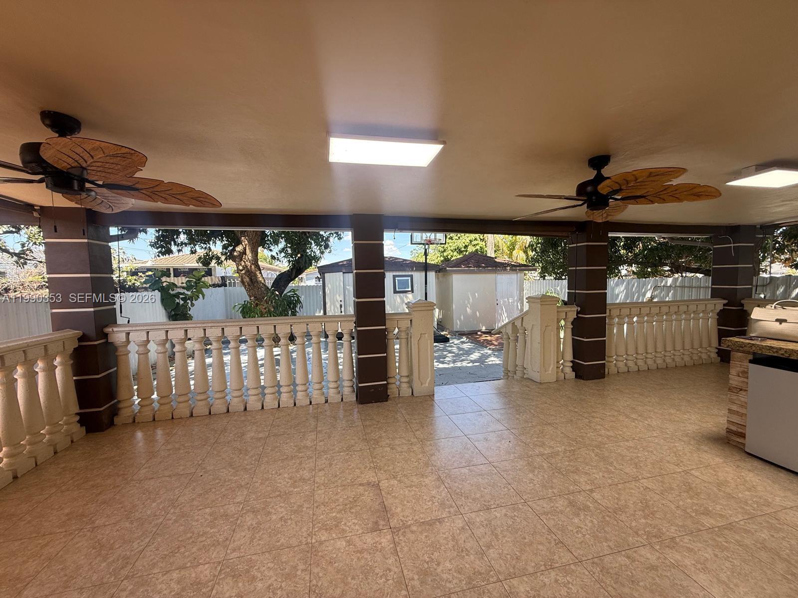 281 West 17th Street, Unit 281 Hialeah, FL 33010 - Photo 16 of 25 a view of a livingroom with furniture and a garage
