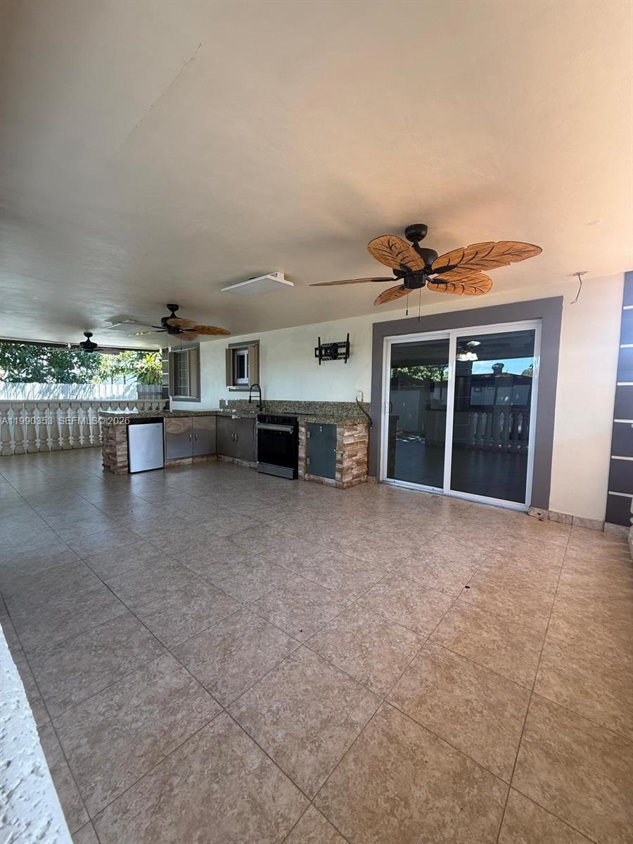 281 West 17th Street, Unit 281 Hialeah, FL 33010 - Photo 18 of 25 a view of a livingroom with furniture and a stove