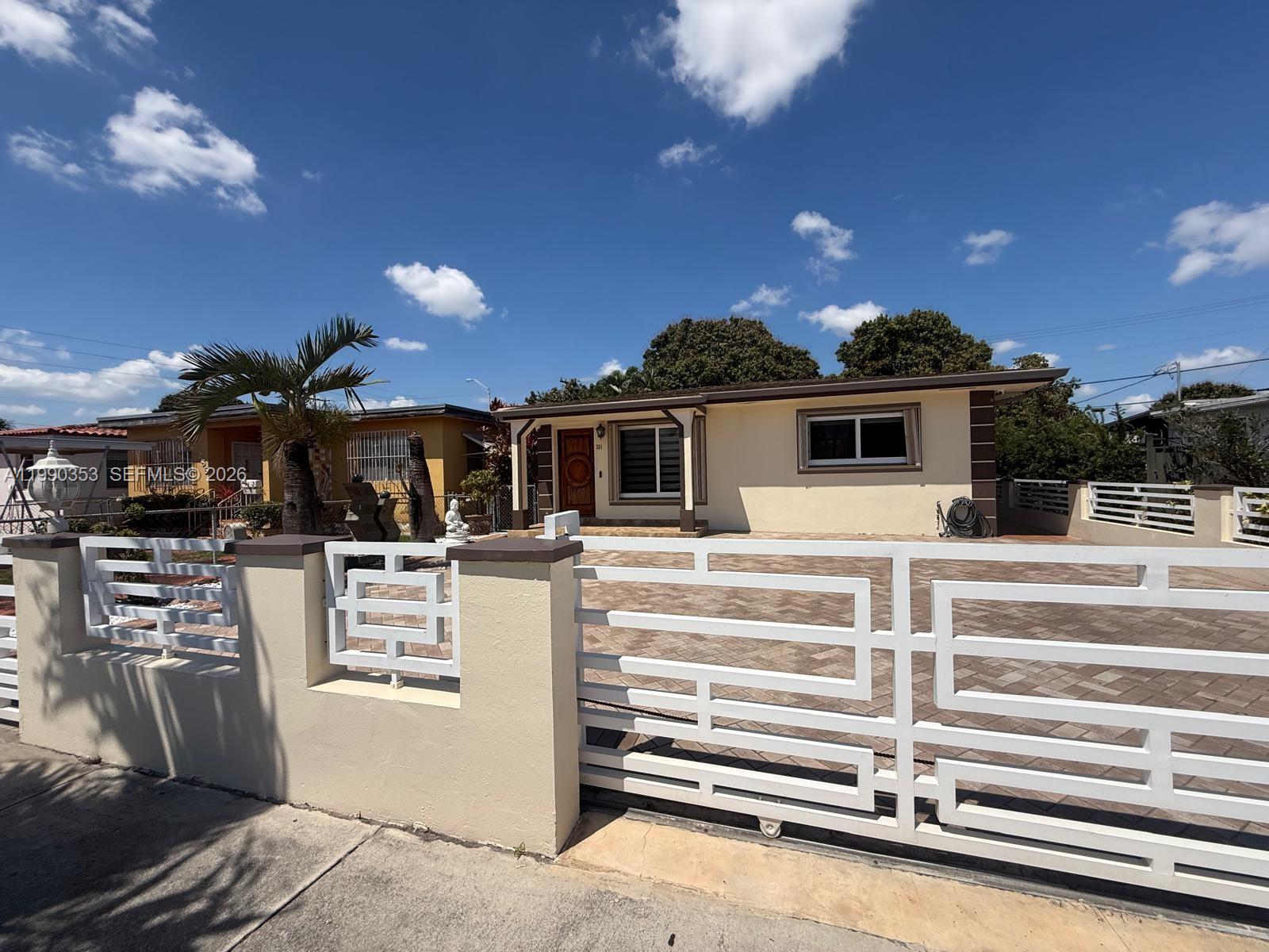 281 West 17th Street, Unit 281 Hialeah, FL 33010 - Photo 2 of 25 a view of a house with a barbeque grill and a fireplace