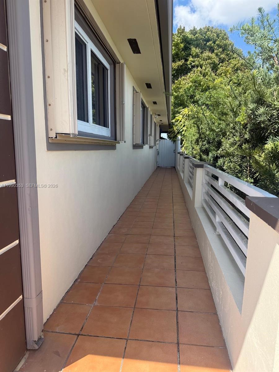 281 West 17th Street, Unit 281 Hialeah, FL 33010 - Photo 22 of 25 a view of a pathway both side of house