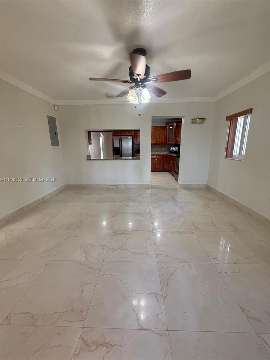 281 West 17th Street, Unit 281 Hialeah, FL 33010 - Photo 6 of 25 a view of a livingroom with a ceiling fan and window