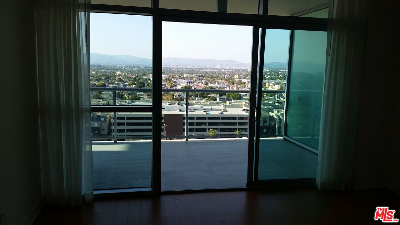 13700 Marina Pointe Drive, Unit 1219 Marina del Rey, CA 90292 - Photo 13 of 48 a view of a glass door and from a balcony