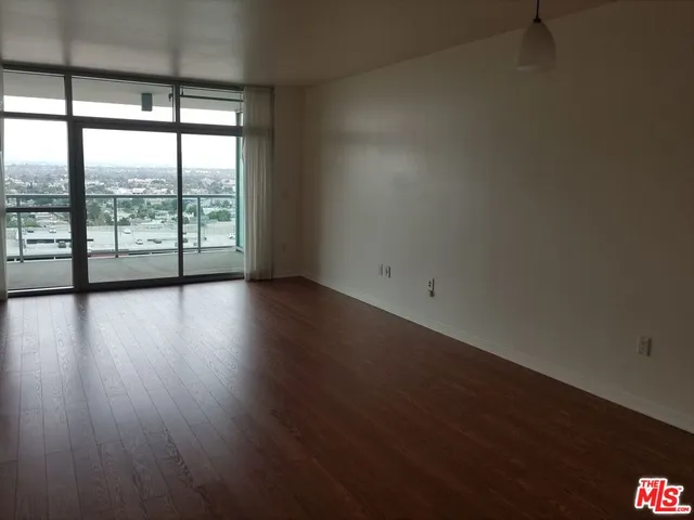 a living room with a table and chairs