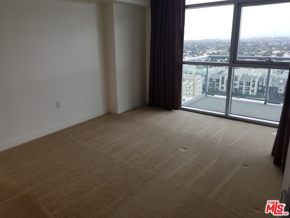 13700 Marina Pointe Drive, Unit 1219 Marina del Rey, CA 90292 - Photo 17 of 48 wooden floor in an empty room with a window