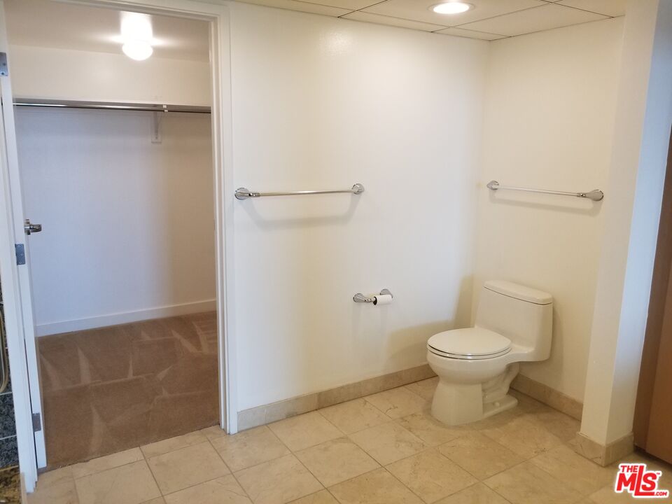 13700 Marina Pointe Drive, Unit 1219 Marina del Rey, CA 90292 - Photo 21 of 48 a bathroom with a toilet and a shower