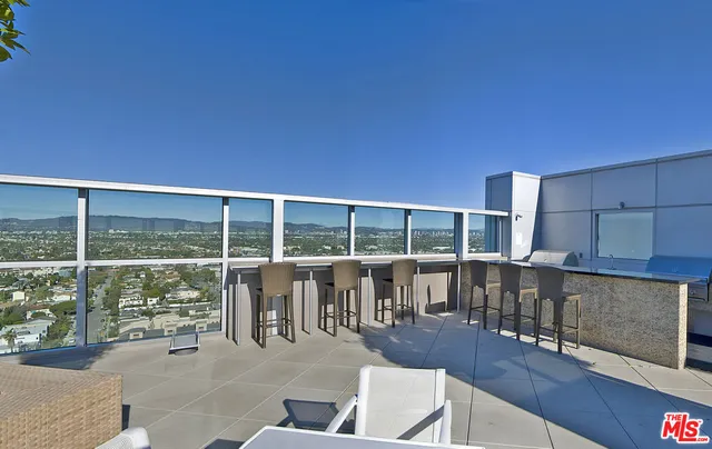 a lobby with furniture and floor to ceiling window