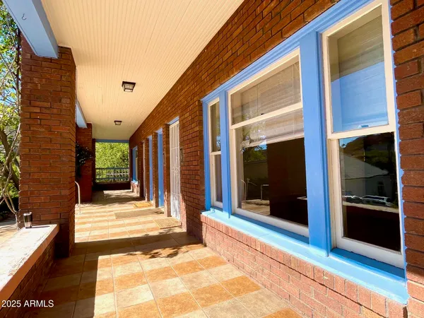 a kitchen with a refrigerator a stove and a window