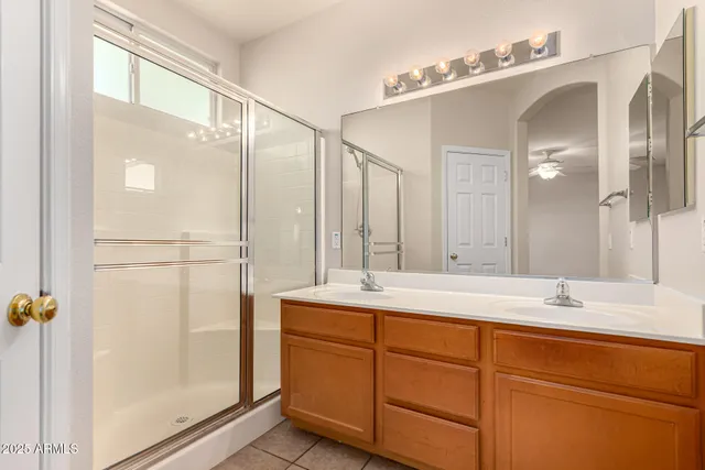 a bathroom with a double vanity sink mirror and double