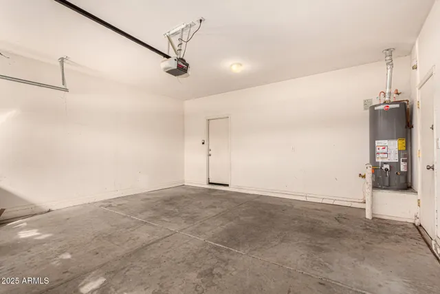 a view of a big room with closet and windows