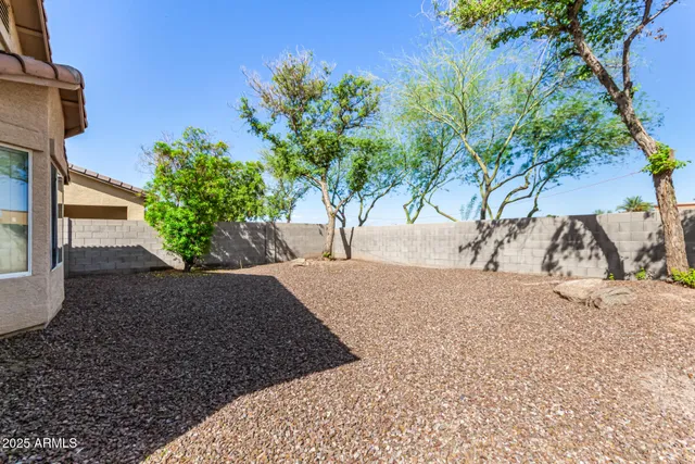 a view of a backyard of the house