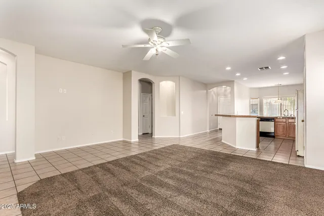 a view of a kitchen with a sink and a refrigerator