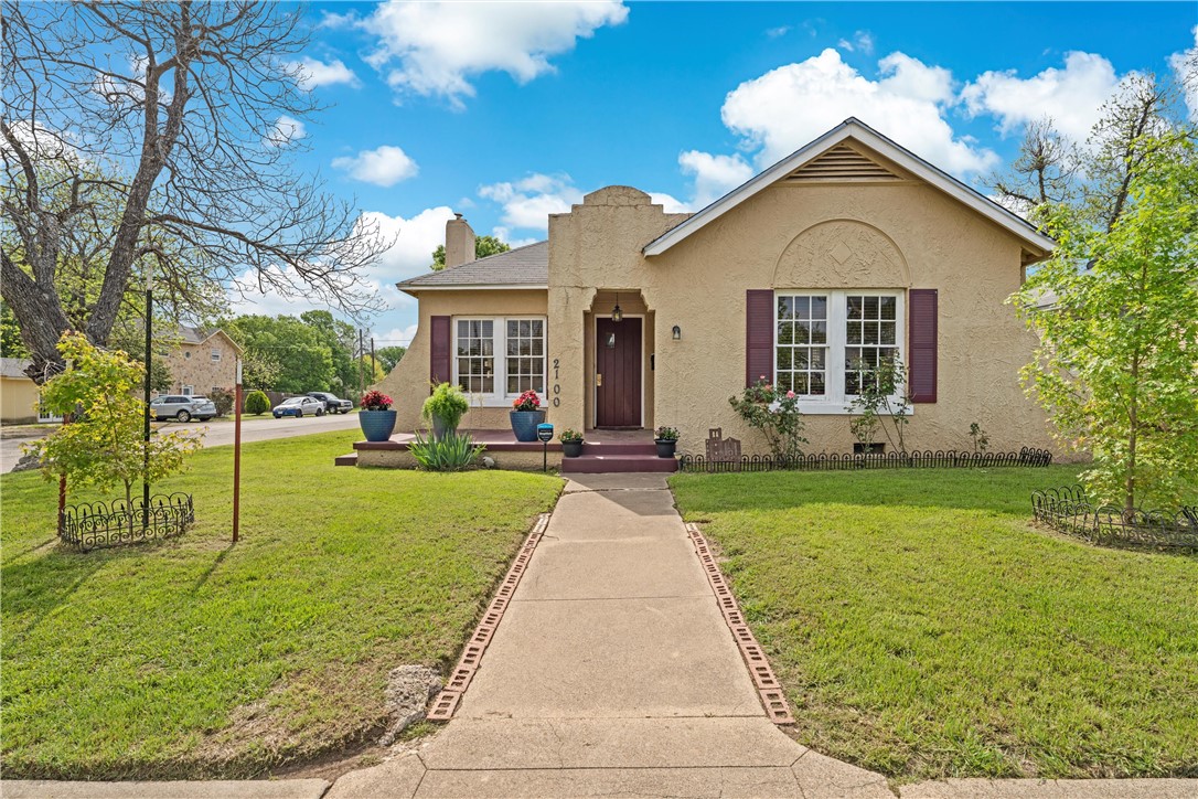 front view of a house with a yard