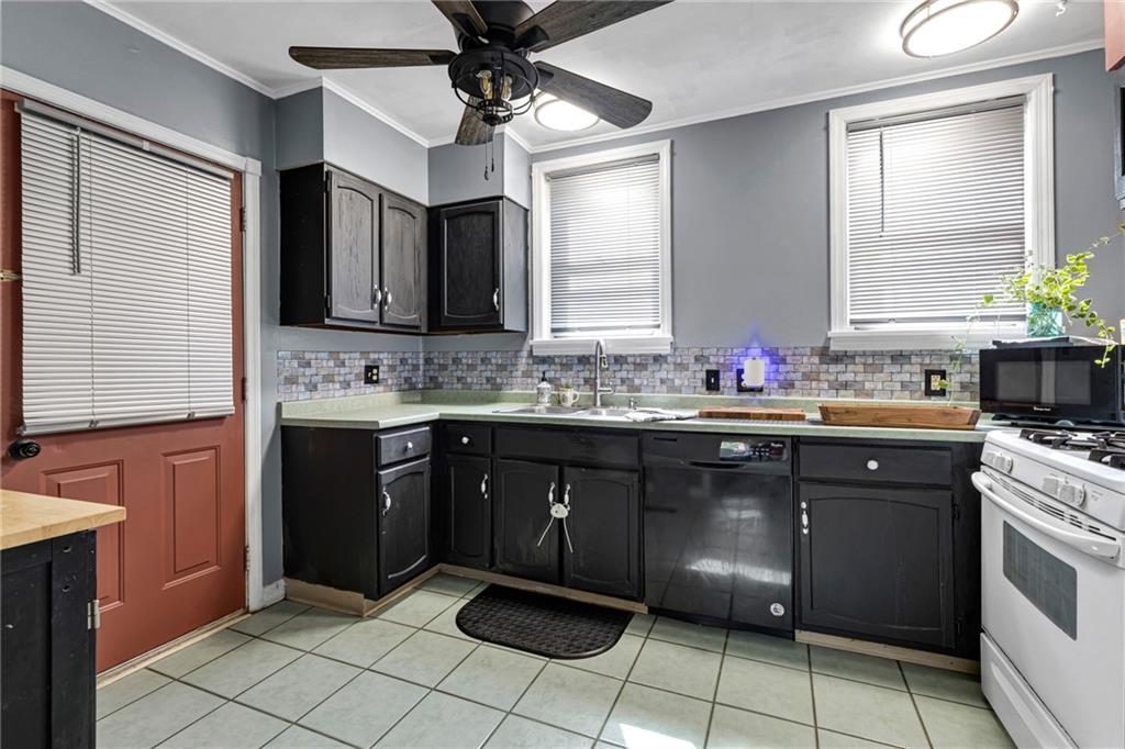 1201 5th Avenue Freedom, PA 15042 - Photo 11 of 32 a kitchen with a sink cabinets and window