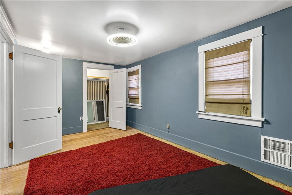 1201 5th Avenue Freedom, PA 15042 - Photo 17 of 32 a bedroom with a bed and a window
