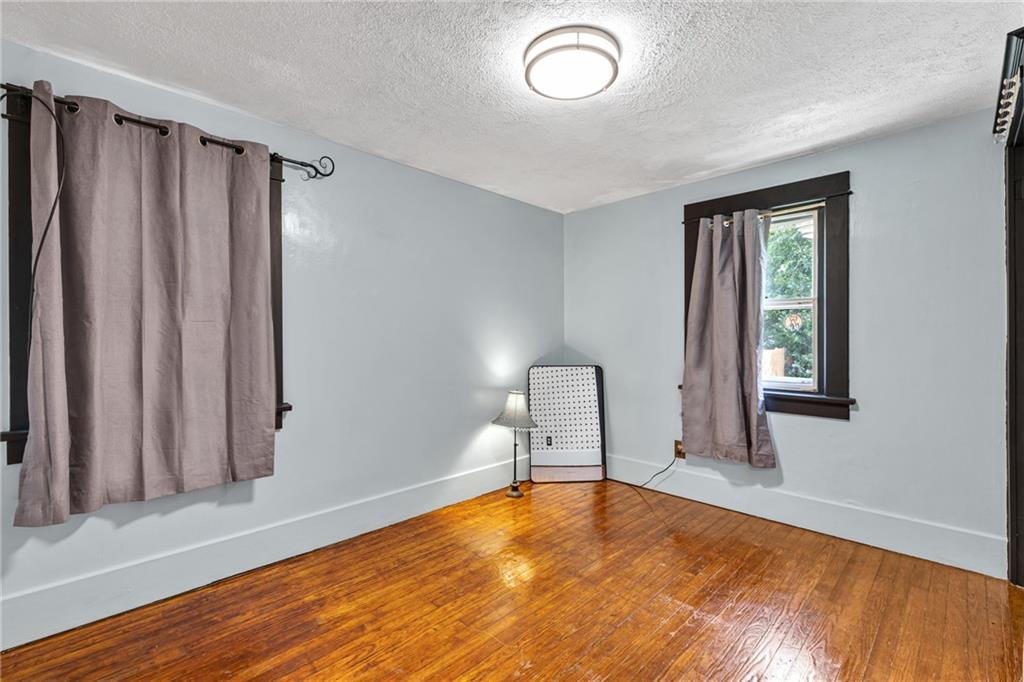 1201 5th Avenue Freedom, PA 15042 - Photo 21 of 32 a view of a livingroom with wooden floor and a window