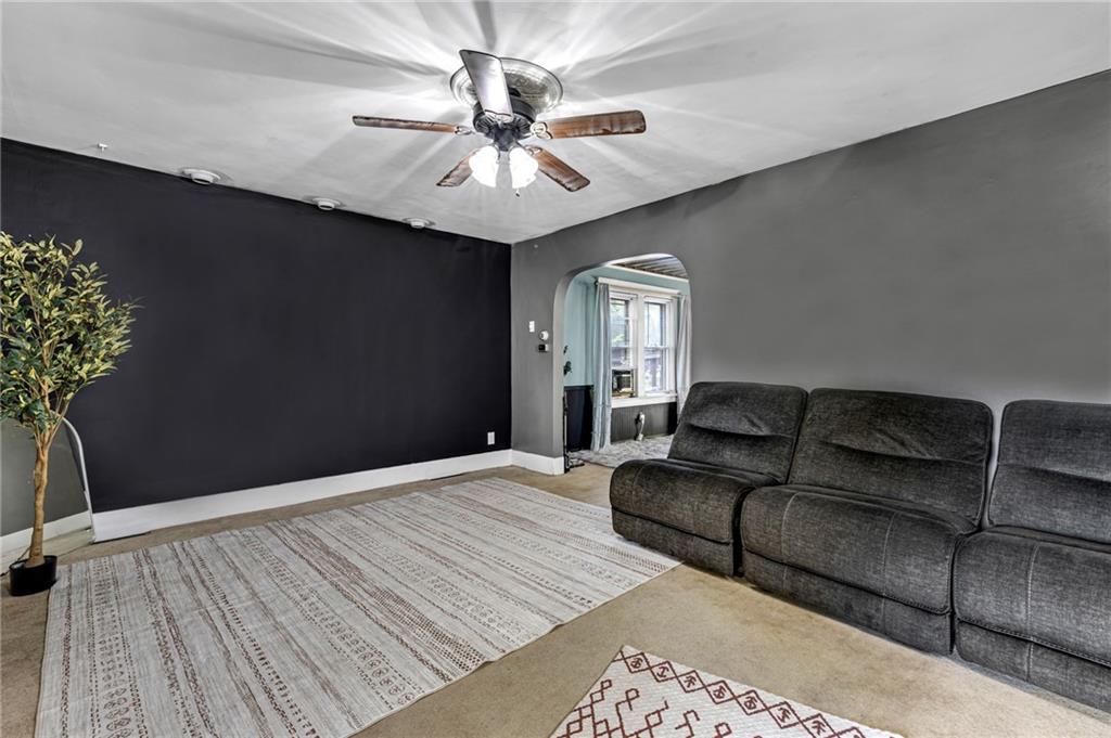 1201 5th Avenue Freedom, PA 15042 - Photo 6 of 32 a living room with furniture and a chandelier